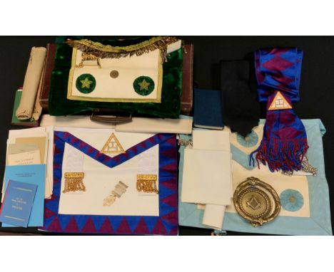 Masonic Interest - a leather case, with assorted sash's, aprons, gilt metal medal, paperwork, instruction books, brass Door K