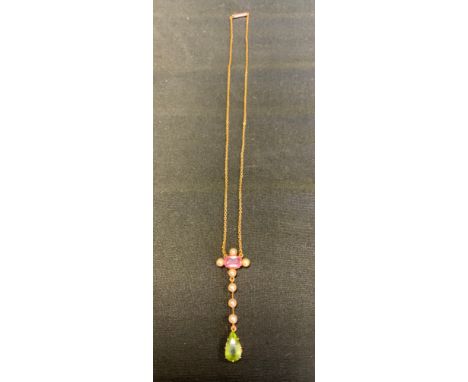 A peridot pink topaz and seed pearl pendant necklace, oval pink topaz quartered with seed pearls, suspending three further se