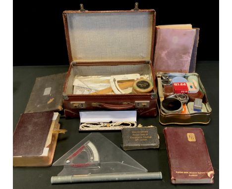 A Draughtsman's drawing implements set,  scale rules, triangular rules and adjusters,  vintage camera lenses, filters, etc,  