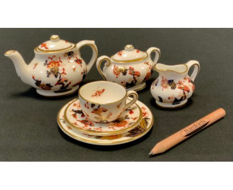 A group of six Coalport Miniature tea sets including Red Willow pattern bachelor tea set, comprising teapot, sugar bowl, milk