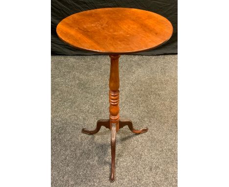 An early 20th century mahogany tall tilt-top table, circular top, turned column, carved tripod feet, 75.5cm high, 46.5cm diam