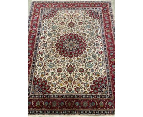 A large Persian Hamadan rug / carpet, knotted with central lotus-shape medallion, within a field of stylised scrolling vines 