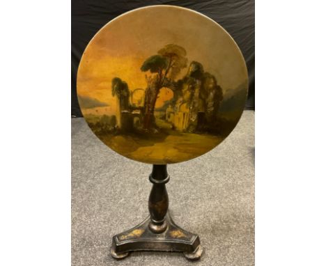 A Victorian painted papier-mache occasional table, the tilting top painted with figures within classical Ruins , turned colum