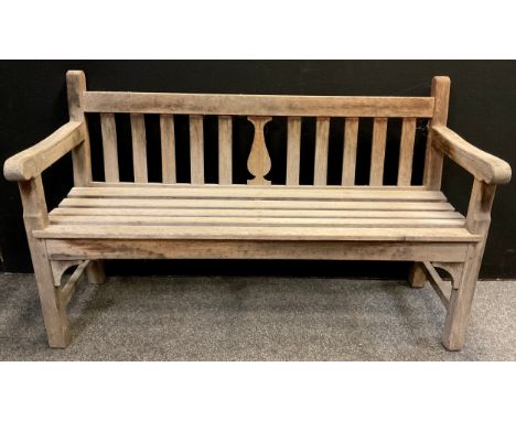A pitch pine garden bench, 91cm high x 149.5cm wide x 57.5cm deep. 