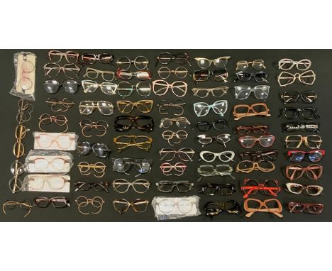 A large quantity of Ophthalmic spectacle frames including; Christian Dior, Converse and Playboy; etc. 1970s an later qty 