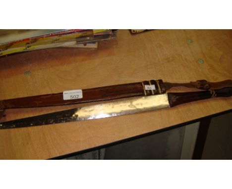 Vintage African sword in leather sheath