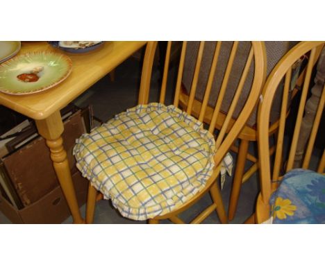 Modern light wood dining table and four sidechairs