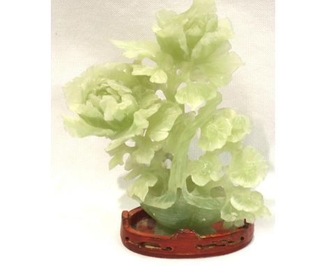 Green jade foliage sculpture on a wooden base. H: 20 cm. P&amp;P Group 1 (£14+VAT for the first lot and £1+VAT for subsequent