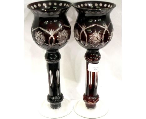 Pair of Bohemian ruby cranberry glass candle holders, no chips or cracks, H: 30 cm. P&amp;P Group 2 (£18+VAT for the first lo
