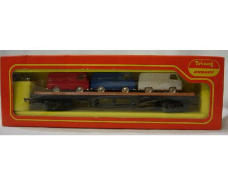 Triang Hornby R563 Bogie bolster with three Ford vans, excellent condition, box with storage wear. P&amp;P Group 1 (£14+VAT f