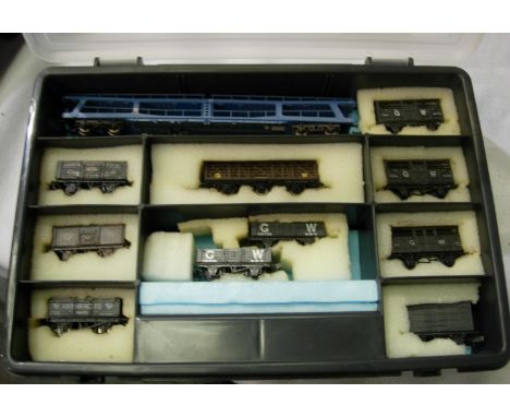 N gauge; eleven wagons including a car transporter, mostly in very good condition, in storage box. P&amp;P Group 1 (£14+VAT f