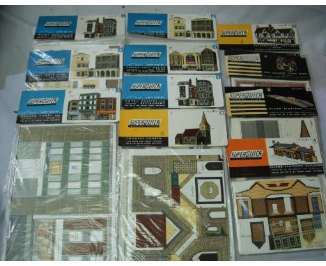 Eleven Superquick card building kits, shiops, cinema, church, houses, station mostly sealed in packets. P&amp;P Group 1 (£14+