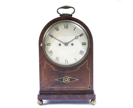 A REGENCY MAHOGANY BRACKET CLOCK of dome topped form, the white enamel dial with Roman Numerals, brass strung decoration and 