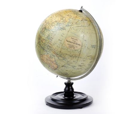 A 12 INCH TERRESTRIAL GLOBE, by George Philip &amp; Son Ltd., with Harrods Ltd, Knightsbridge retailer's label, circa 1930, o