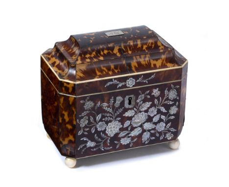 A WILLIAM IV TORTOISESHELL AND MOTHER OF PEARL INLAID TEA CADDY, of chamfered rectangular form, the front inlaid with flowers