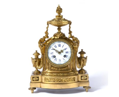 A 19TH CENTURY FRENCH ORMOLU MANTEL CLOCK the convex white enamel dial with blue Roman numerals and black Arabic five minutes