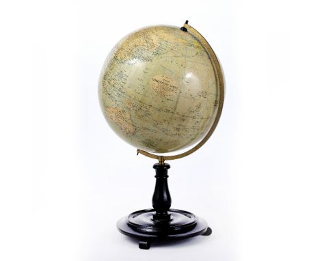 AN EARLY 20TH CENTURY 12 INCH TERRESTRIAL GLOBE by George Philip &amp; Son Ltd., 32 Fleet St, London, on turned ebonised stan