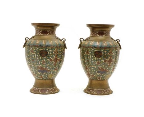 A pair of Chinese cloisonné vases, the lobbed bulbous bodies, with ring handles and foliate stylised decoration, 34cm highCon