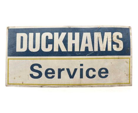 A vintage Duckhams service sign, in blue, yellow and white, 50cm x 100cmCondition report: Fading and pitting to surface, pane