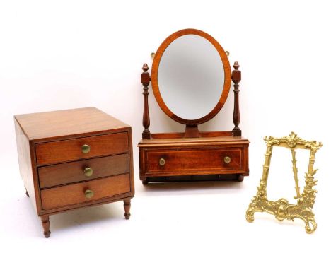 A mahogany table top cabinet, 19th century, with oak lined push through drawers, raised on turned supports, 34cm wide, 22.5cm