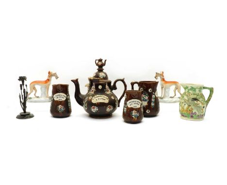 A Victorian Bargeware teapot, inscribed 'A present from a friend', the cover with a teapot form finial, 32cm high, together w