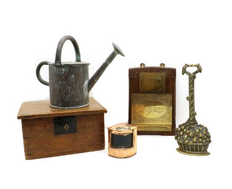 A wooden box with metal items, comprising: 19th century brass basket of fruit doorstop, copper watering can, letter rack, sma