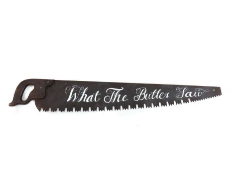 A vintage sign in the form of a saw, hand-painted inscription 'What the Butler Saw', 105cm longCondition report: Minor surfac