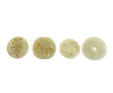 A collection of Chinese jade pendants, comprising: one with coins, tied to a string, 4.7cm diameter, one with Liu Hai with a 