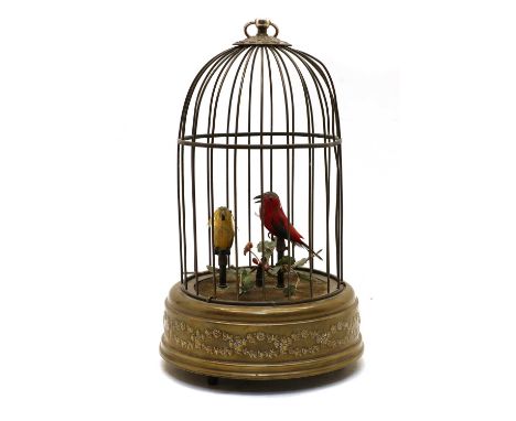 A singing birdcage automaton, 20th century, brass-cased, with a dome top, the round suspension loop above the top disc decora