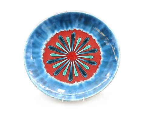 A Poole charger, decorated by Nicola Massarella, with a central red circle, with a blue border, painted and moulded marks, 40