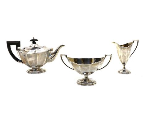 An Edwardian three piece silver tea service, by John Round &amp; Son Ltd, impressed Sheffield, 1901, comprising, a teapot, cr