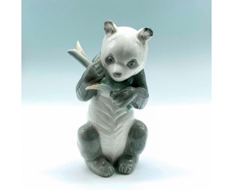 Glossy panda bear with bamboo. Nao by Lladro backstamp on bottom. Dimensions: 3.25"L x 4.25"W x 6.5"HManufacturer: Nao by Lla