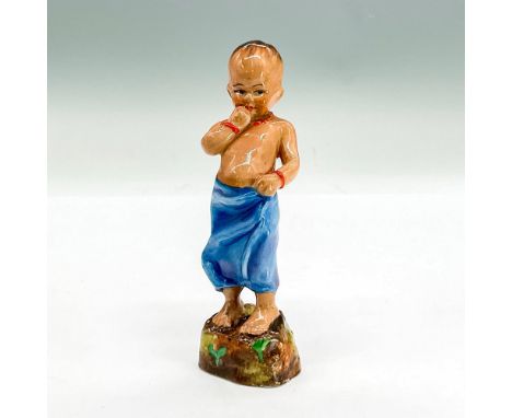 Bone china figure of a young boy in a blue sarong, red necklace and bracelets. Royal Worcester backstamp. Part of the Childre