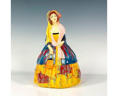 Glaze finish figure of a provincial lady in a bright yellow, red and blue dress with a blue overcoat, black bonnet, yellow sc