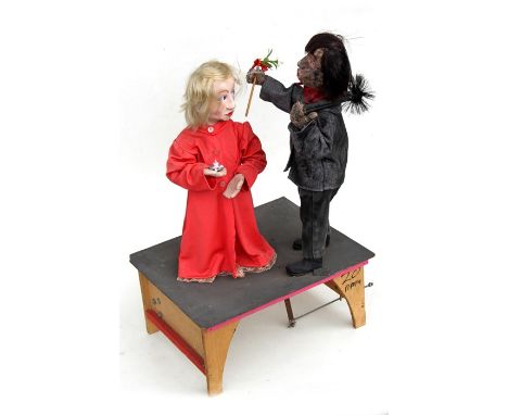 An automation group of a chimney sweep kissing a young girl, overall 72cms high.Condition Reportseems to be on working order