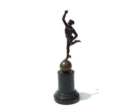 A bronze figure of Hermes standing on a globe, mounted on a marble plinth, 28cms high.