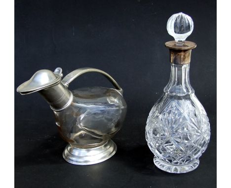 A silver mounted decanter; together with an Italian Marinoni pewter mounted wine carafe (2).