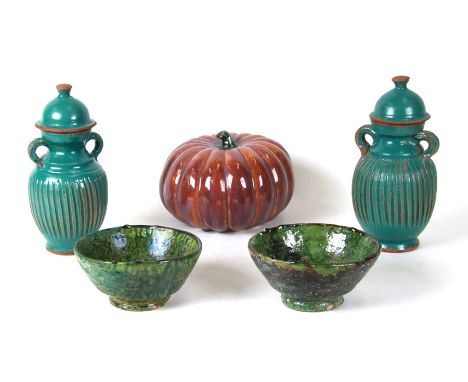 A pair of Chinese twin-handled green glazed vases and covers; together with a ceramic pumpkin, 20cms diameter; and a pair of 