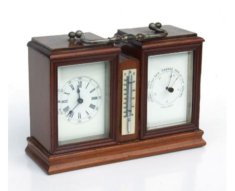 A French walnut cased desk top barometer clock with central thermometer, 19cms wide.Condition Reportticking but not tested fo