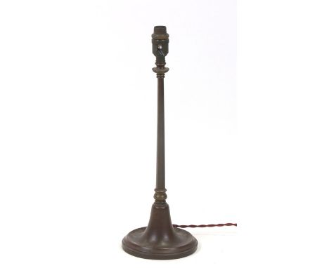 An early 20th century WAS Benson style lamp with loaded circular base and a tapering hexagon column, 43cms including fitting.