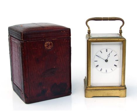 A French gilt brass carriage clock by Holingue Freres, the white porcelain dial with Roman numerals and blue steel hands, fit