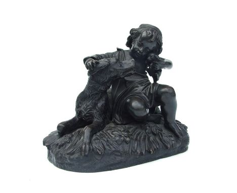 A bronze group depicting a young girl holding a puppy and stroking a dog, 16cms wide.