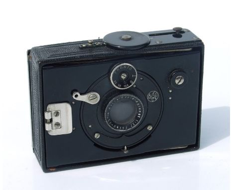 An AGC Compact bellows camera, cased.