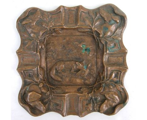 A cast bronze rectangular ashtray decorated with hunting scenes, 13cms wide.