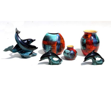 A quantity of Poole Studio pottery to include a baluster vase, 20cms high; together with two similar vases; a dolphin group a