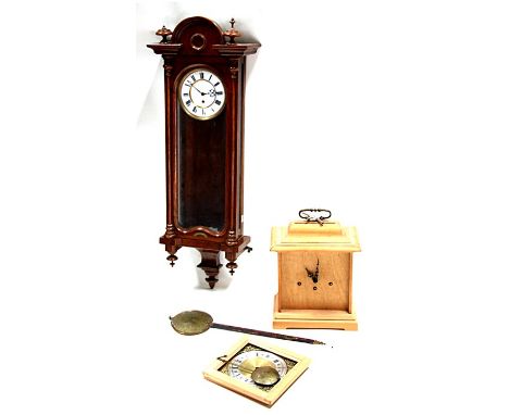 A Vienna style wall clock in a walnut case, 88cms high; together with a George III style table clock in a pin case, 26cms wid