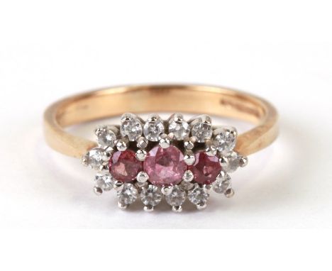 A 9ct gold zirconia and pink stone dress ring, approx UK size 'O'.