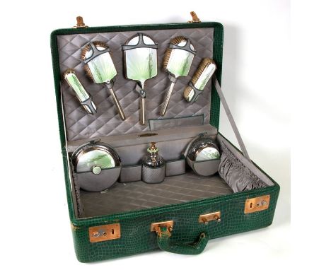 A silver and guilloche enamel dressing table set, Birmingham 1947/48, decorated with lilies of the valley, to include jars, c