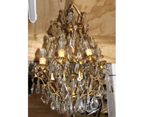 A gilt metal and crystal drop ceiling light, approx 75cms high.