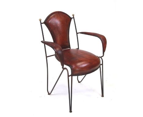 A Carlo Bugatti style open armchair with steel wirework frame and leather back rest, seat and arms.Condition Reportnot new, l